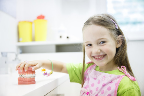 Little girl smiling at orthodontist